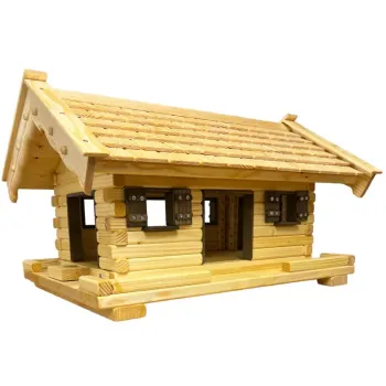 vogelhaus-middel-kleine-holzschindeln-dunkelbraun-gebeizte-türen-fensterzargen-fensterlaeden-ausziehboden-boden-mit-zaun